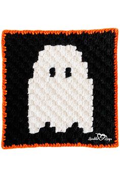 a crocheted halloween ghost on black and white background with orange trimmings