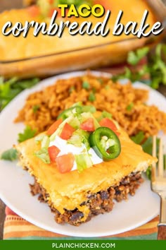 taco cornbreadd bake on a white plate with a fork next to it