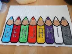 a row of crayons with the word name jane written in them on a table