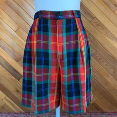 These adorable plaid shorts can be worn dressed up or down. Would be a great Christmas look with some tights.  Excellent condition.  By Rafaella Measurements taken while flat: Waist: 28" Hips: 40" Inseam:  7" Rise: 13" Preppy Plaid Short Bottoms, Fitted Plaid High-waisted Shorts, Plaid High-waisted Fitted Shorts, Retro Plaid Short-length Bottoms, Fitted Plaid Shorts, Retro Plaid Short Bottoms, Suit Shorts, Christmas Look, Plaid Suit