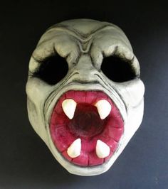 an odd looking mask with its mouth open