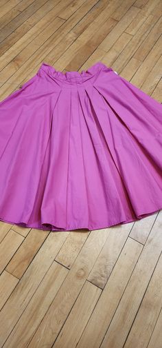 This pretty in pink skirt is made of 100% Cotton and has lovely pleated detailing in the front. It measures a 27" waist and 25.5" in length, hitting just below the knee. Handmade personally by Hollyville shop owner, Pam Pink Pleated A-line Skirt, Pink A-line Pleated Skirt, Fitted Pink Midi Dress, Pink Accordion Pleats Skirt, Spring Pink A-line Bottoms, Pink Pleated Dress With Flared Skirt, Pink Pleated Flowy Dress, Spring A-line Pink Bottoms, Pink Flowy Pleated Skirt