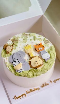 there is a cake decorated with animals on it