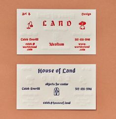 two white business cards with red and blue lettering