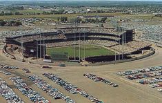 an aerial view of a baseball stadium with cars parked in the lot and lots of parking