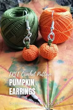 Tiny crochet pumpkin earrings hanging from two spools of thread on an autumnal leaf Micro Crochet Patterns, Tiny Crochet