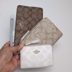 100% Authentic Or Money Back Guarantee !!! Coach Cj721 Corner Zip Trio In Signature Canvas Gold/Khaki Multi Signature Coated Canvas And Smooth Leather Inside Credit Card Slots Zip-Top Closure, Fabric Lining Detachable Wrist Strap Large Pouch: 7 3/4" (L) X 4 3/4" (H) Medium Pouch: 6 1/4" (L) X 4" (H) Small Pouch: 5" (L) X 3 1/4" (H) Style No. Cj721 Mini Coach Purse, Coach Mini Wallet, Cute Coach Wallet, Gold Coach Wallets For Daily Use, Coach Gold Wallets For Daily Use, Coach Purse And Wallet Set, Xoxo Jewelry, Luxury Bags Collection