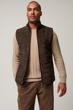 Our sporty and versatile Gavin vest is ready to take on cool-weather days. Made from soft yet durable lamb suede, this quilted leather vest is the perfect pick for fall adventures, from hiking amidst the changing leaves to taking in a Sunday football game. A classic cut with standup collar and full front zip pairs perfectly with your favorite jeans and boots, while four pockets offer space to store your keys and phone. Leather Winter Outdoor Vest, Brown Vest Outerwear For Outdoor Activities, Quilted Vest For Layering In Fall, Winter Outdoor Brown Vest, Leather Sleeveless Vest For Winter, Leather Sleeveless Winter Vest, Sleeveless Outerwear For Hiking In Fall, Sleeveless Outerwear For Fall Hiking, Sleeveless Fall Outerwear For Hiking