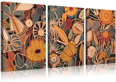 three canvases with flowers and leaves on them, one in orange and the other in blue