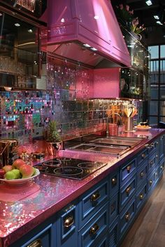 a kitchen with blue cabinets, pink counter tops and metallic backsplashes on the counters