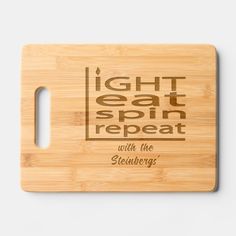 a cutting board with the words light eat repeat