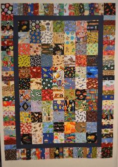 a large quilt hanging on the wall