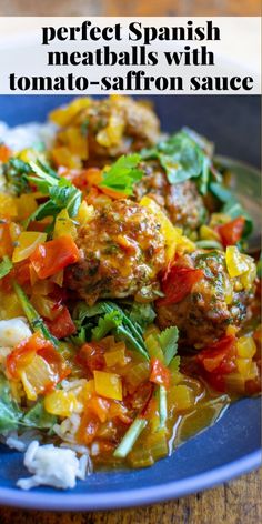 a blue plate topped with meatballs and vegetables