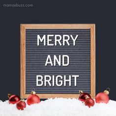 merry and bright written on a sign surrounded by christmas ornaments in the snow with a black background