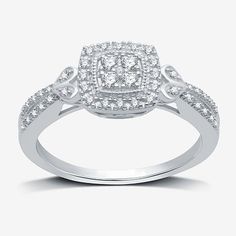 Give the gift of commitment with this beautiful women's halo promise ring. It features round-cut genuine diamonds in a cushion-shape set in Sterling Silver. The band is accented with subtle heart details for extra sweetness. Ring Style: Halo Rings, Side Stone Rings, Promise Rings, Engagement Rings, Multi Diamond RingsDiamond Clarity: I3Setting: Multi-SettingShape: CushionStone Cut: RoundDiamond Color: I-JMetal Color: WhiteRounded Carat Weight: 1/4 Ct. T.w.Care: Wipe CleanStone Type: 45 Natural D Rings Promise, Silver Cushions, Rings Engagement, Ring Style, Halo Rings, Modern Bride, Promise Ring, Promise Rings, White Diamond