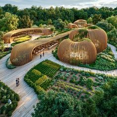 an artist's rendering of a wooden structure surrounded by greenery