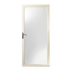 a white door with a mirror on the front and side paneled in gold hardware