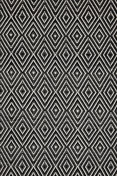 an abstract black and white pattern on fabric