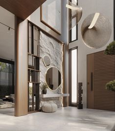 the interior of a modern house with stone and wood accents, including round mirrors hanging from the ceiling