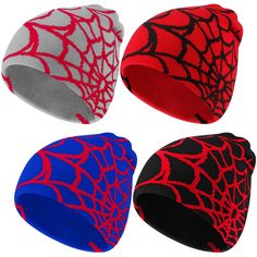 three beanies with spider webs on them, one red and the other blue