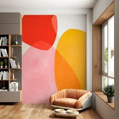 an orange chair in front of a large painting on the wall next to a window