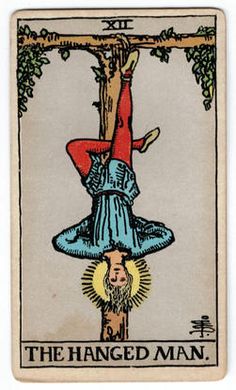 the hanged man tarot card with an image of a person hanging from a tree