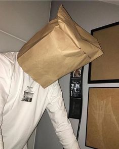 a man with a paper bag on his head