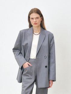 This is MOHAN’s double-breasted blazer made of a sturdy wool blend fabric. It features built-in shoulder pads for a structured silhouette, adding a formal touch to your outfit.- Perfect for daily wear- Can be styled with various looks for versatility- Fully lined for added comfort and durability Spring Gray Suits For Workwear, Gray Double-breasted Formal Blazer, Spring Gray Suit For Work, Spring Gray Workwear Suits, Gray Blazer With Double Button Closure And Suit Collar, Gray Double Breasted Suit For Office, Gray Double-breasted Suit For Office, Gray Lapel Collar Suit For Fall, Gray Double-breasted Suit For Work