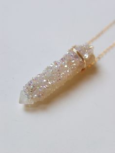 "Featuring a single beautiful Angel Aura Spirit Quartz Raw stone which was handcrafted into a 14k gold filled bezel set pendant piece. The stone has a pretty natural sparkle. This necklace highlights the beautiful elements of this arresting stone. The stone measures approx. 1.25\" long and 15mm wide. Chain is 18\" long. Handmade in my California studio This is a Limited Edition Piece Edition! Please allow for natural variation in crystals. No two are the same. They are unique just like you! Each Spirit Quartz Necklace, Angel Aura Crystal, Raw Crystal Necklace, Spirit Quartz, Aura Crystals, Angel Aura Quartz, Beautiful Angel, Color Corrector, Angel Aura