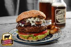 a hamburger and beer are sitting on a table