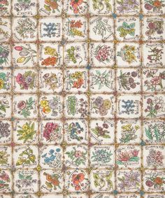 an old quilt with many different flowers on it