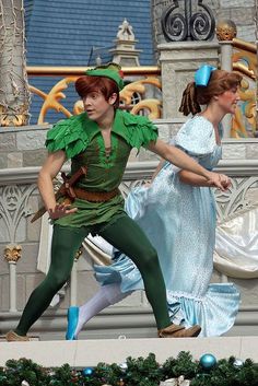 two people dressed as peter pan and tinkerbell