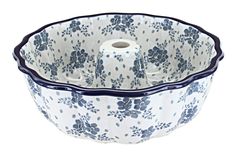 a blue and white flowered bowl with two rolls in the bottom, on a white background