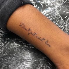 a person with a tattoo on their arm that says, don't you want to live?