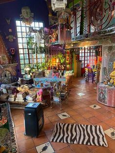 a room filled with lots of colorful items and decor on the walls, floors, and ceiling