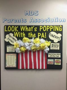 a bulletin board with popcorn on it that says, kids parents association look what's popping with the pa