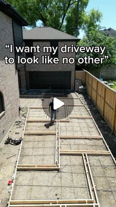 a man standing in front of a house with the words, i want my driveway to look like no other?