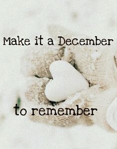 a white teddy bear sitting on top of a pile of blankets with the words make it a december to remember