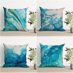 four pillows with different designs on them, one is blue and the other has white flowers