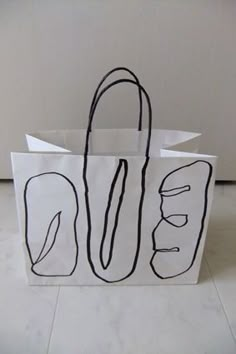 a white paper bag with black lines on it