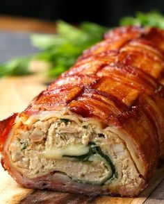 a close up of a meatloaf roll on a cutting board