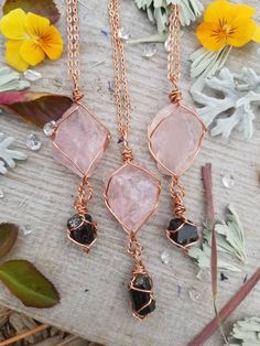 "Pink as can be raw rough all natural rose quartz combined with the power of black tourmaline! How can you go wrong!? These pendants come in pure copper or fine silver, your choice! Real leather chords are authentic suede leather tied to be adjustable so you can wear it at your desired length Faux leather chords are \"vegan friendly\" because they are actually cotton made to look like leather. These chords are also tied to be adjustable You may also choose to purchase these pendants with a chain Wire Wrapped Jewelry Diy, Handmade Crystal Jewelry, Raw Crystal Jewelry, Tourmaline Pendant, Wire Wrapping Crystals, Rose Quartz Pendant, Rose Quartz Necklace, Quartz Jewelry, Homemade Jewelry