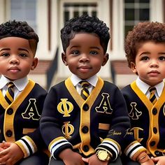 three young boys wearing black and yellow sweaters sitting next to each other in front of a building