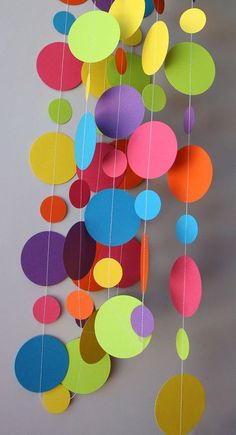 multicolored paper circles hanging from the ceiling