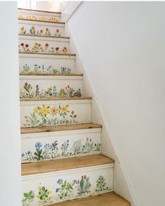 the stairs are painted with flowers on them