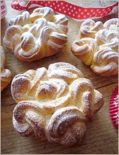 several pastries sitting on top of a wooden table