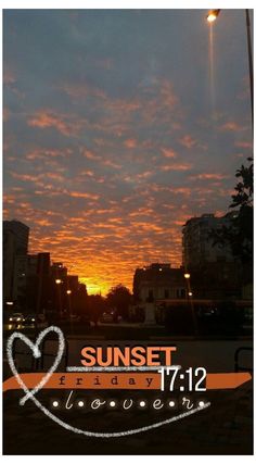 the sun is setting in the sky over some buildings and street lights with words that read sunset friday, november 12th