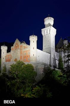 the castle is lit up at night time