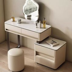 a dressing table with two stools and a mirror on the wall in front of it