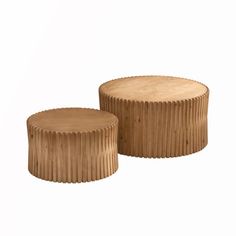 two wooden stools sitting next to each other